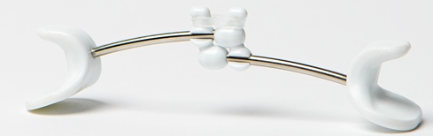 Close up image of a Facial Flex device on a blank background